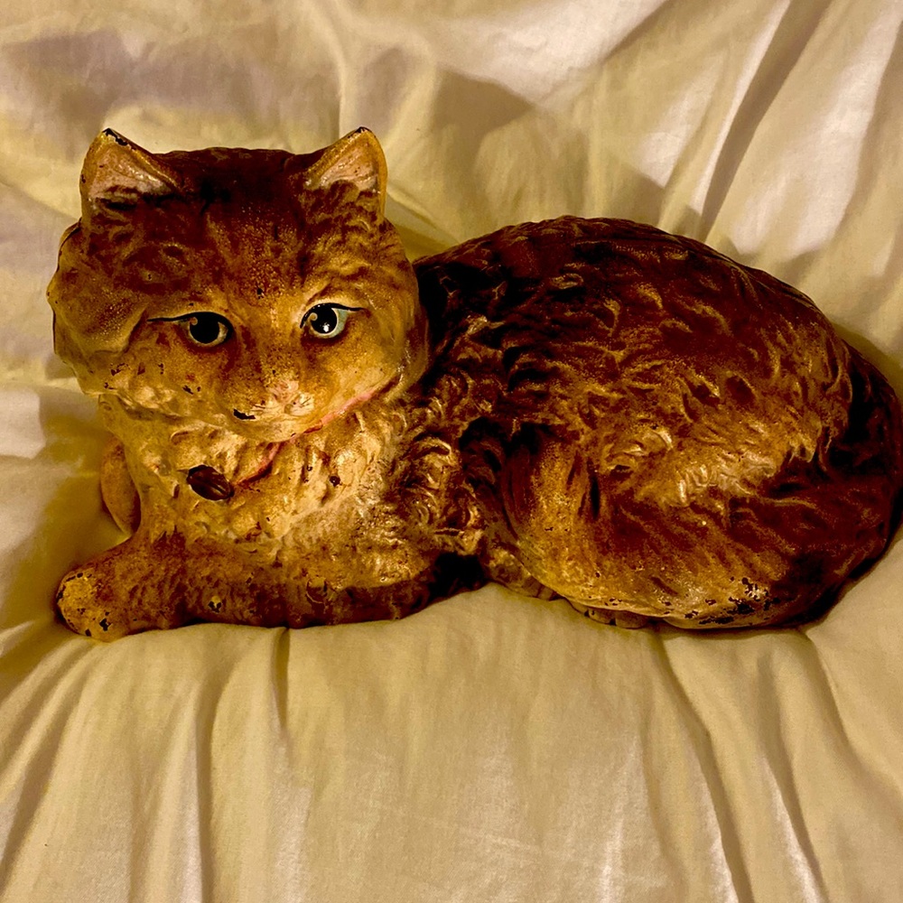 Hubley of Lancaster, PA lounging cat with pink bow cast iron doorstop